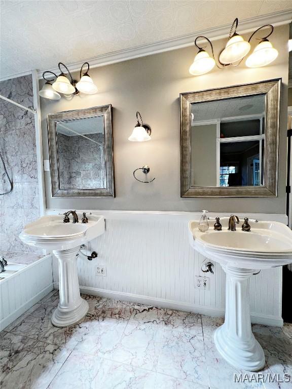 bathroom with a bathing tub and ornamental molding