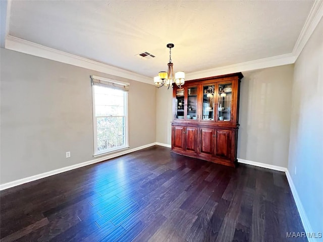 unfurnished dining area with a notable chandelier, dark hardwood / wood-style flooring, and crown molding