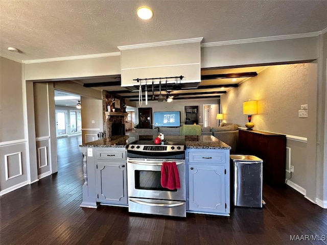 kitchen featuring white cabinetry, ceiling fan, kitchen peninsula, stainless steel range with electric stovetop, and ornamental molding