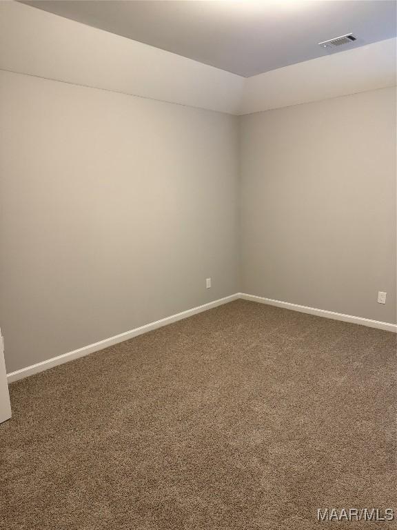 empty room featuring carpet flooring