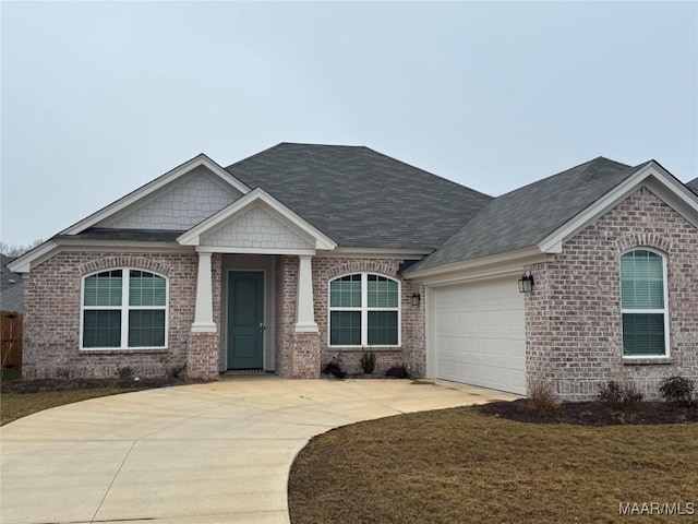 view of front facade with a garage and a front yard