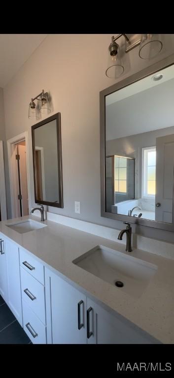 bathroom featuring tile patterned floors and vanity