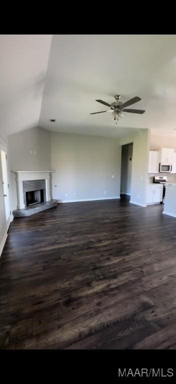 unfurnished living room with dark hardwood / wood-style floors, ceiling fan, and lofted ceiling