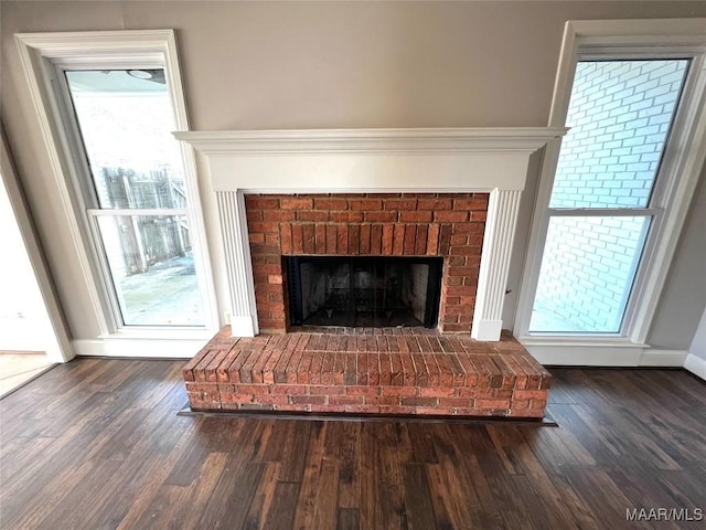 interior details with wood-type flooring and a fireplace