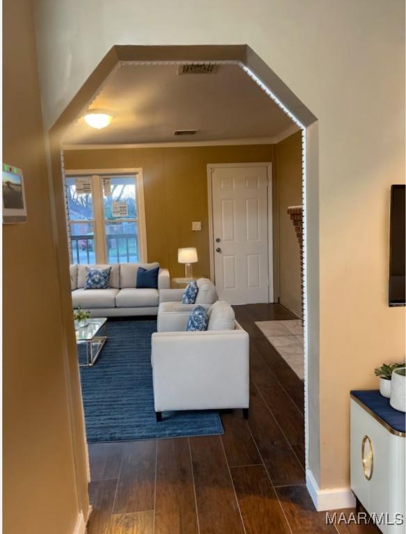 living room featuring crown molding