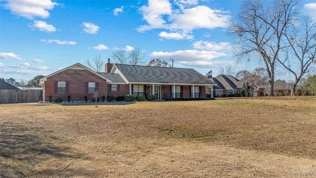 single story home featuring a porch and a front lawn