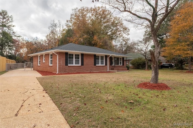 ranch-style home with a front yard