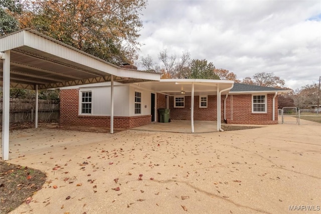 back of house with a carport