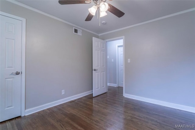 unfurnished room featuring crown molding, ceiling fan, and dark hardwood / wood-style floors