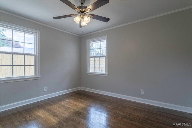 spare room featuring dark wood-type flooring, ceiling fan, and ornamental molding