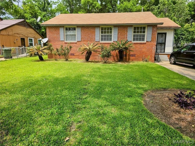 view of front of home with a front lawn