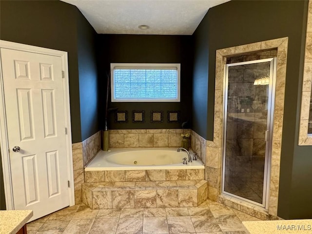 bathroom featuring vanity and separate shower and tub