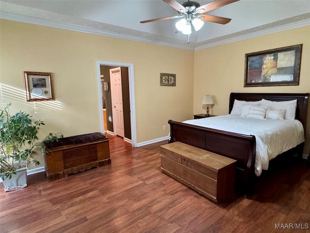 bedroom featuring ceiling fan, dark hardwood / wood-style floors, and ornamental molding