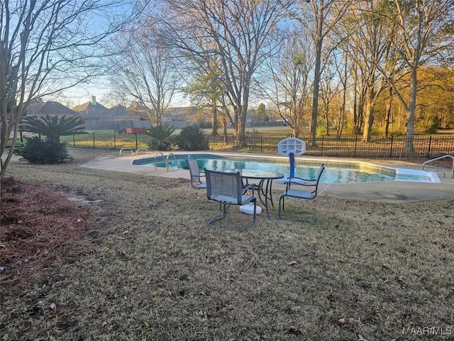 view of swimming pool with a lawn and a patio area