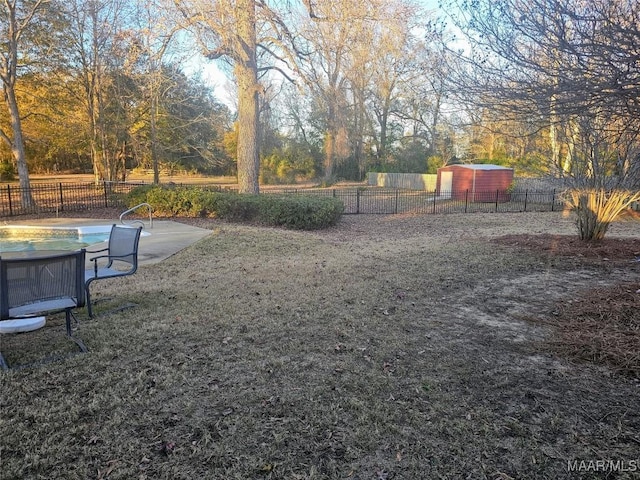 view of yard with an empty pool and a patio area