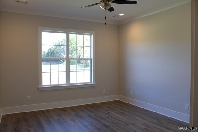 unfurnished room with crown molding, ceiling fan, and dark hardwood / wood-style flooring