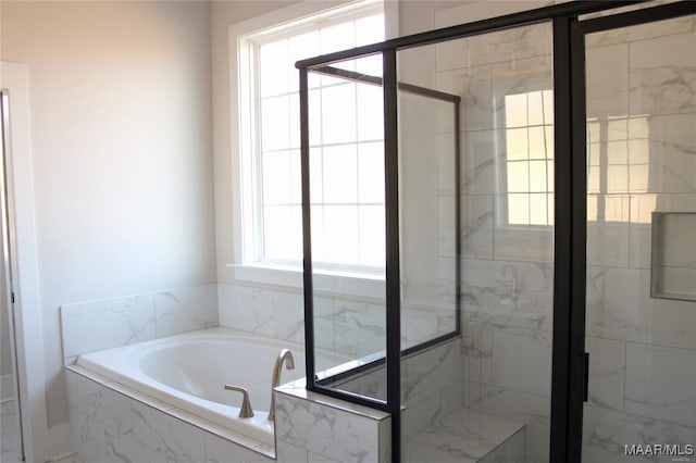 bathroom featuring plus walk in shower