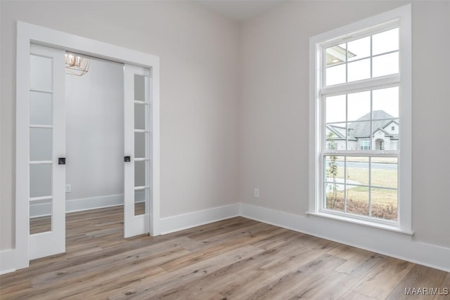 8325 Young Xing, Montgomery, AL 36116 - spare room with wood finished floors and a chandelier