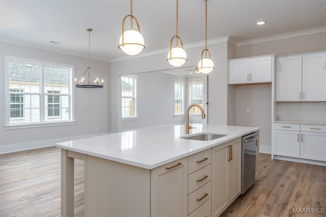 8325 Young Xing, Montgomery, AL 36116 - kitchen featuring stainless steel dishwasher, light wood-style flooring, light countertops, white cabinets, and pendant lighting