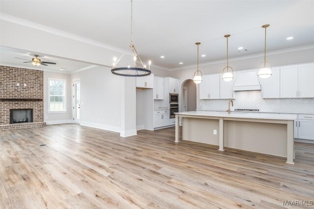 8325 Young Xing, Montgomery, AL 36116 - kitchen with appliances with stainless steel finishes, ornamental molding, tasteful backsplash, white cabinetry, and a ceiling fan