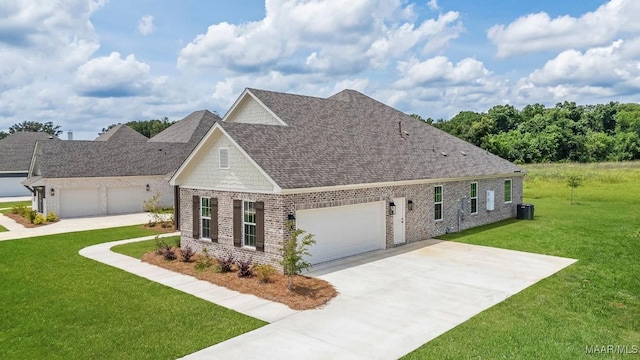 8325 Young Xing, Montgomery, AL 36116 - view of front of property with concrete driveway, a front yard, an attached garage, roof with shingles, and brick siding