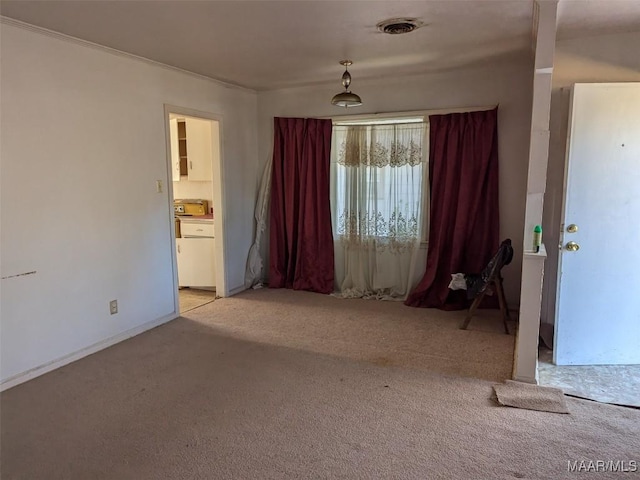 spare room with light carpet