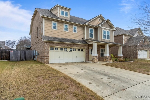 craftsman house with a front lawn, covered porch, and a garage