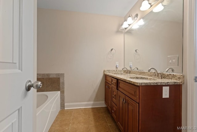 bathroom featuring a bathing tub, tile patterned flooring, and vanity