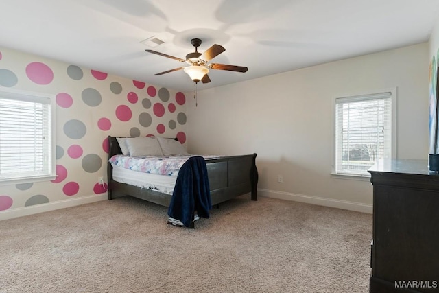 bedroom featuring ceiling fan and light carpet