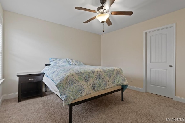 bedroom featuring ceiling fan and light carpet