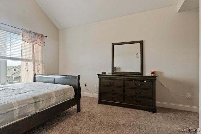 bedroom featuring light carpet and lofted ceiling