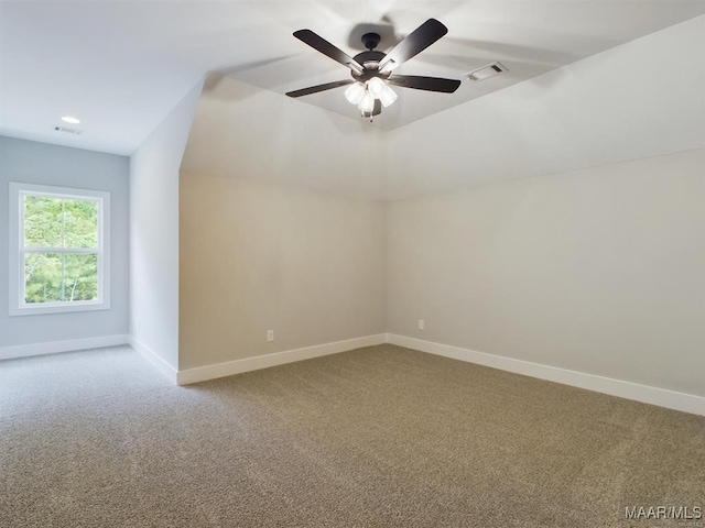 additional living space with ceiling fan and carpet floors