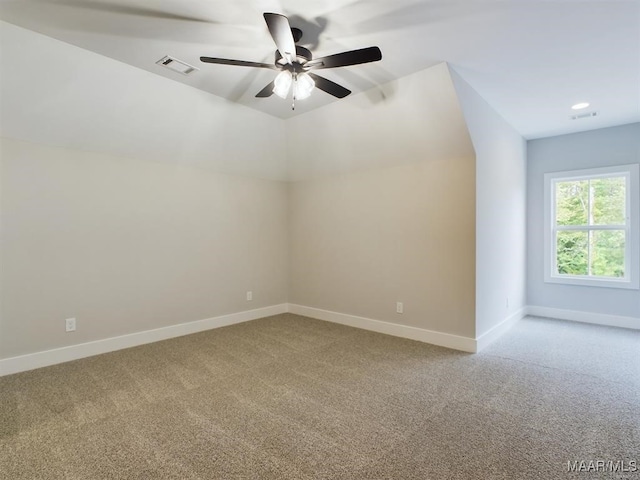 additional living space with lofted ceiling, carpet floors, and ceiling fan