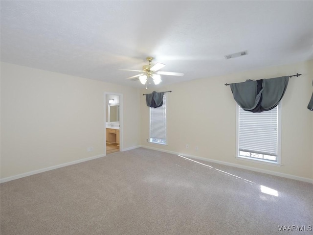 carpeted empty room with ceiling fan