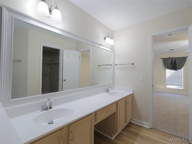 bathroom featuring vanity and hardwood / wood-style flooring