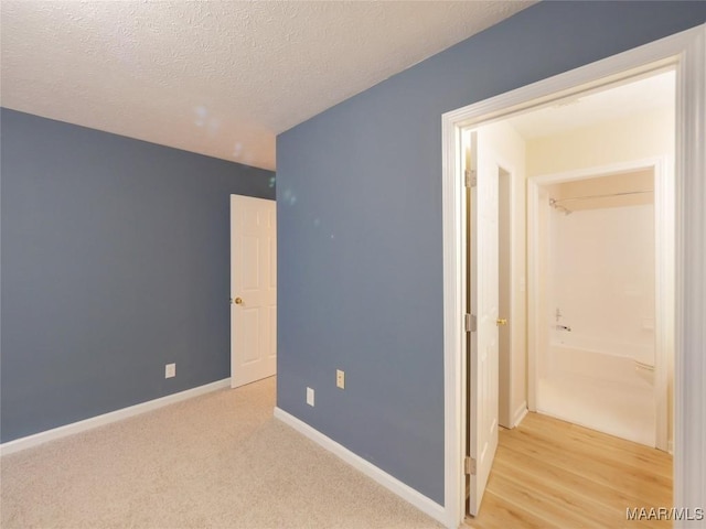 unfurnished bedroom featuring a textured ceiling