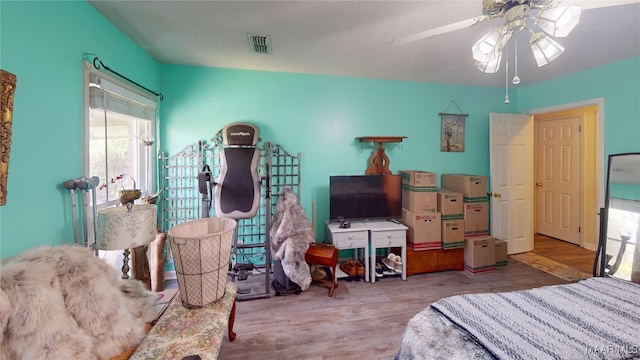 bedroom featuring ceiling fan and wood-type flooring