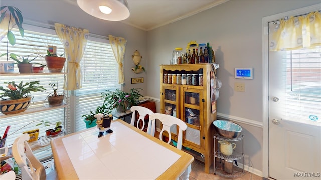 dining area with crown molding