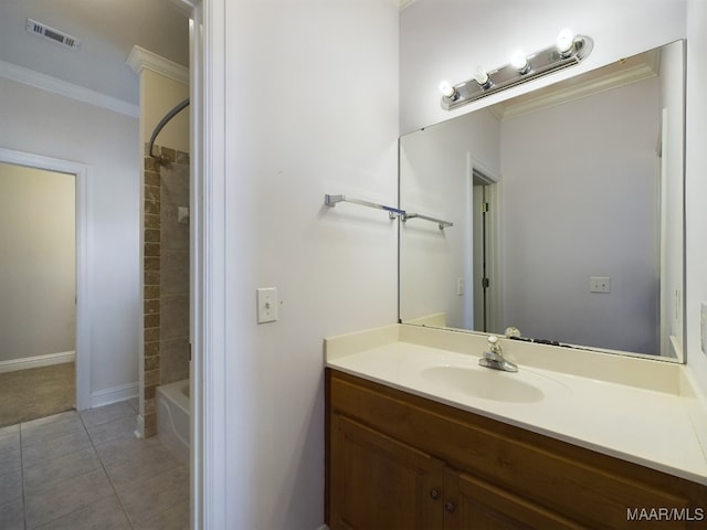 bathroom with tiled shower / bath combo, vanity, tile patterned floors, and ornamental molding