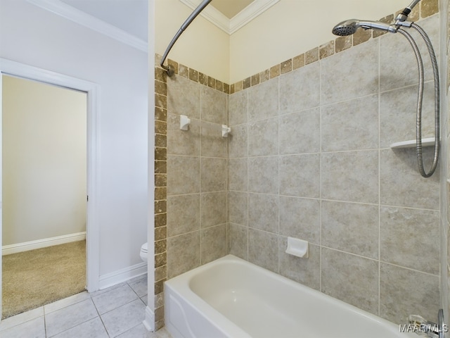 bathroom with toilet, tile patterned flooring, tiled shower / bath, and ornamental molding