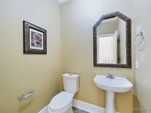 bathroom featuring toilet and sink