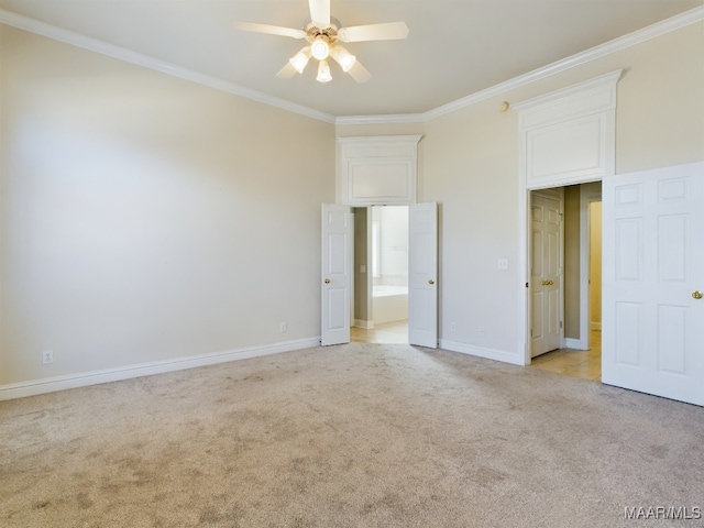 unfurnished bedroom featuring ceiling fan, crown molding, and light carpet