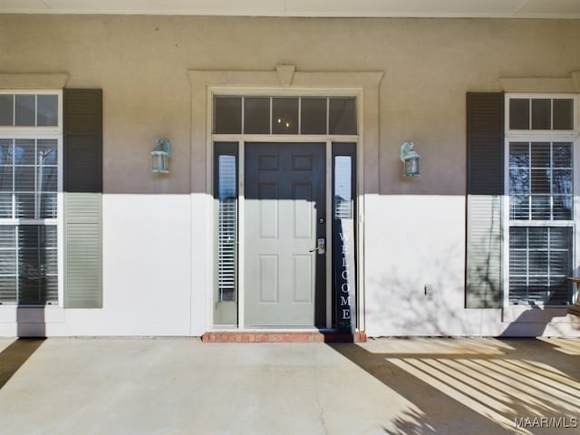 property entrance featuring covered porch