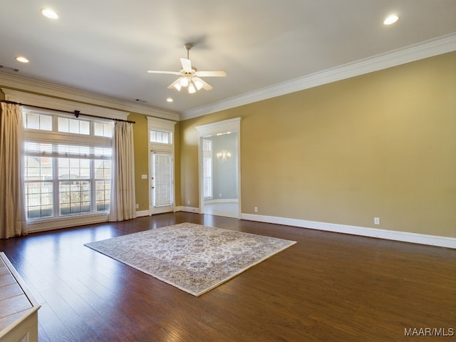 interior space featuring dark hardwood / wood-style flooring, ceiling fan, and crown molding