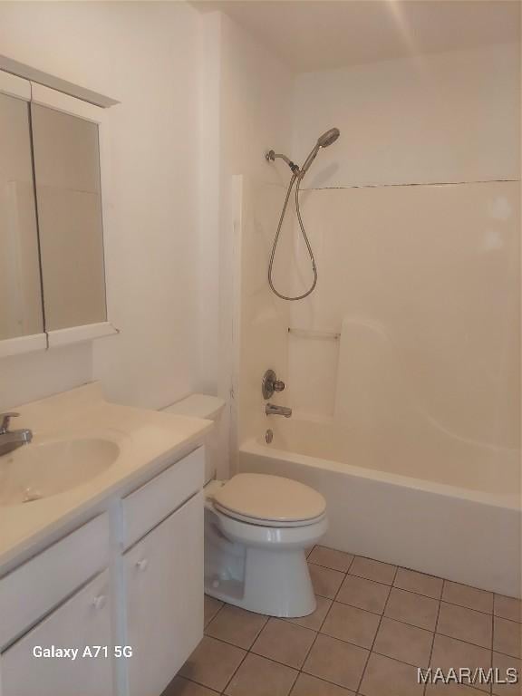 full bathroom with bathtub / shower combination, vanity, tile patterned flooring, and toilet