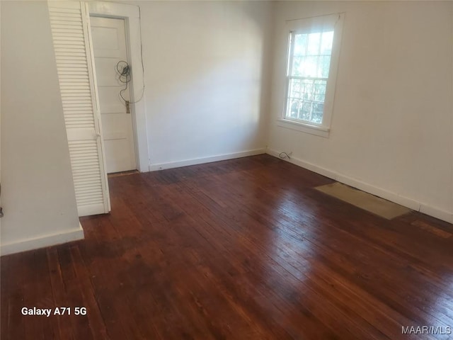 interior space featuring dark hardwood / wood-style floors and a closet