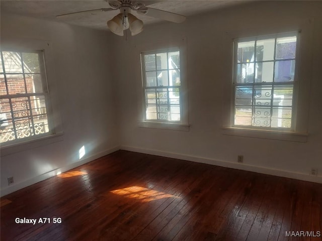 empty room featuring hardwood / wood-style flooring and ceiling fan