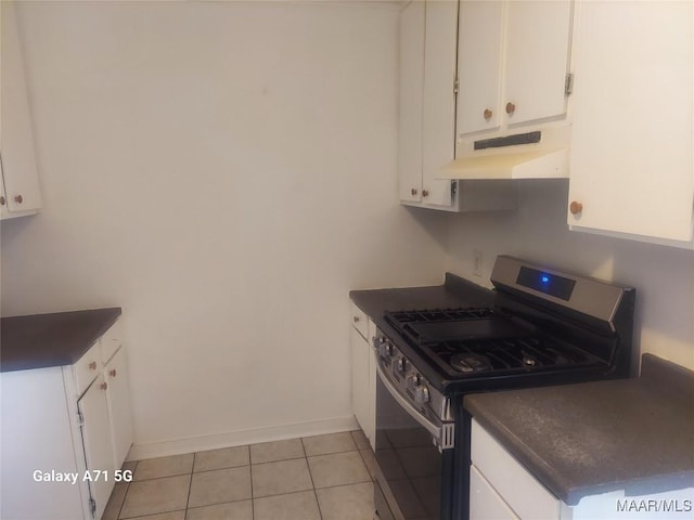 kitchen featuring white cabinetry, stainless steel gas stove, and light tile patterned flooring