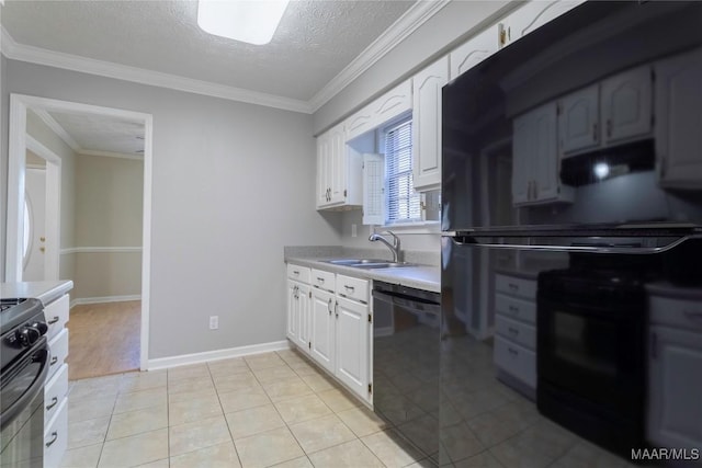 kitchen featuring a textured ceiling, sink, black appliances, light tile patterned floors, and white cabinets