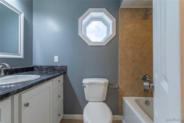 full bathroom featuring vanity, toilet, and tiled shower / bath